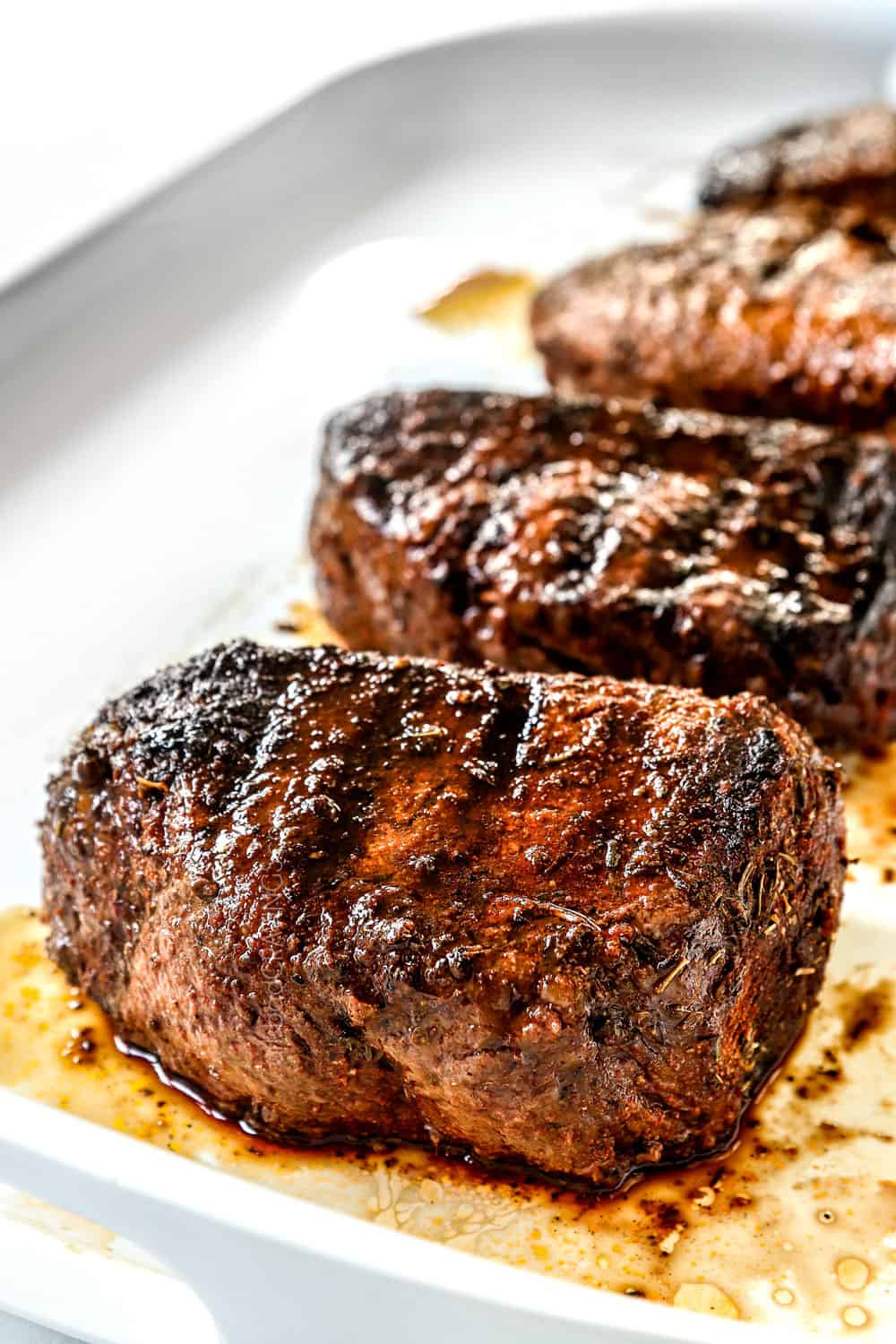 up close side view of grilled sirloin steak showing how juicy it is