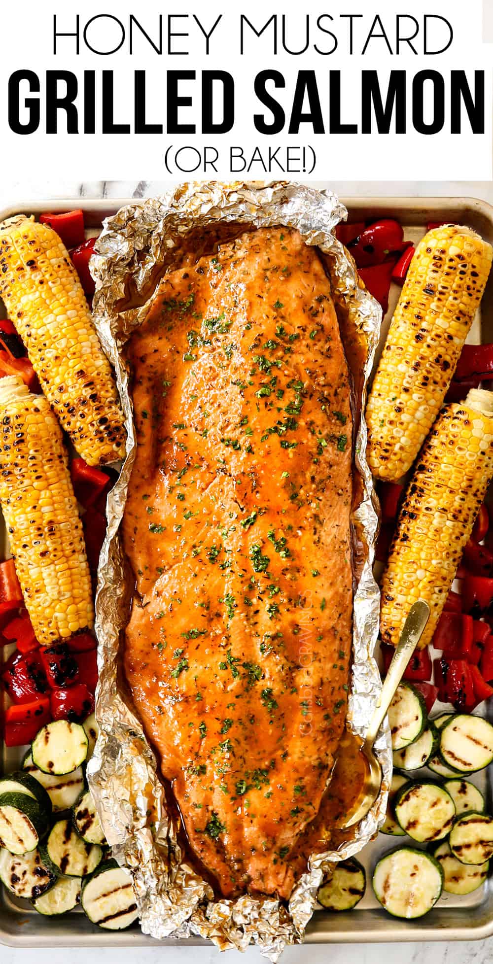 top view of grilled salmon in foil with grilled vegetables
