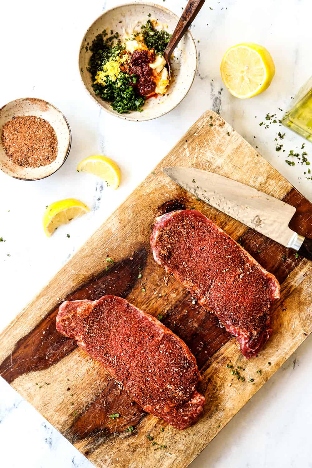 showing how to make New York Strip Steak (Strip Steak, NY Strip Steak) with top view of recipe ingredients: strip steak, spice rub and compound butter