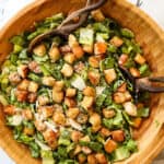 top view of Caesar Dressing recipe with Romaine lettuce, Parmesan, croutons and Caesar Dressing