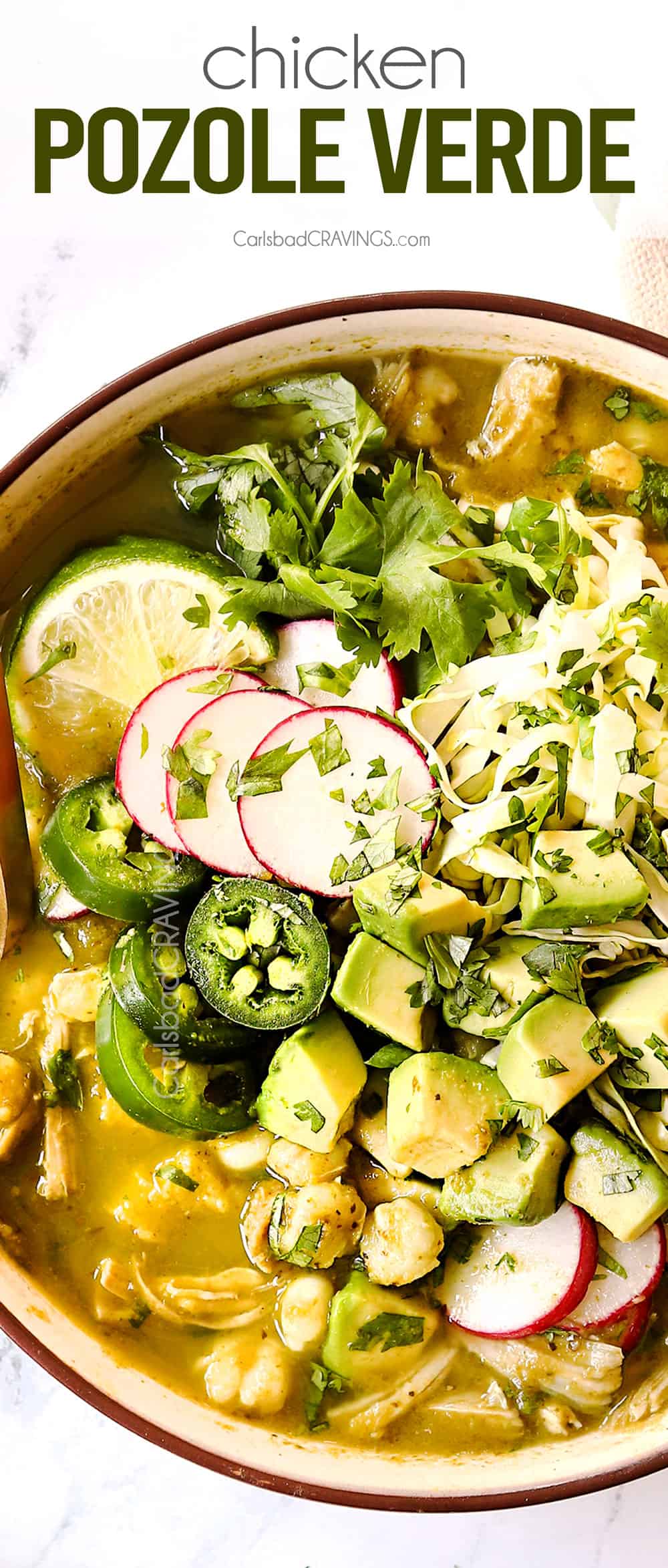 top up close view of showing how to top pozole verde de pollo (posole) with radishes, cilantro, avocados and radishes