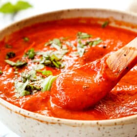 a spoonful of roasted red pepper sauce recipe showing how smooth it is