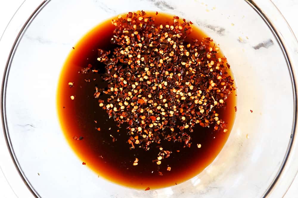 showing how to make ginger beef by adding soy sauce, brown sugar, rive vinegar and red pepper flakes to a glass bowl