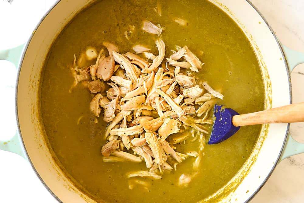 showing how to make pozole verde (posole) recipe by adding shredded chicken back to the soup