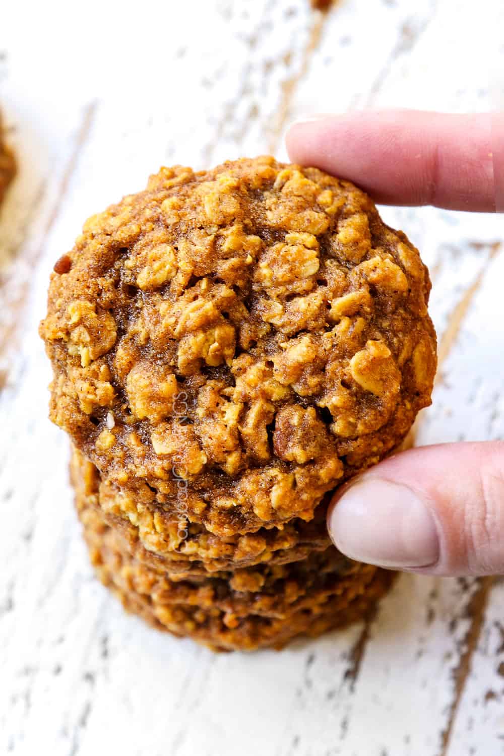 a stack of pumpkin oatmeal cookies with pecans