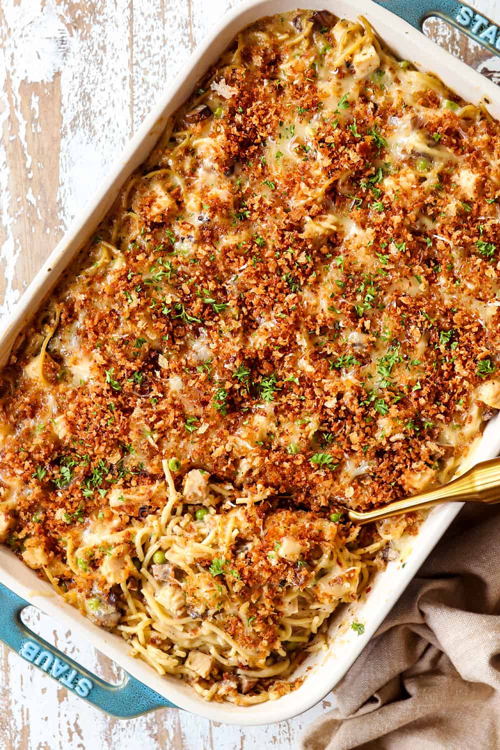 showing how to make turkey tetrazzini recipe by baking until the cheese is melted