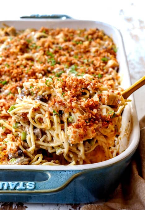 scooping up turkey tetrazzini recipe with a spoon to serve