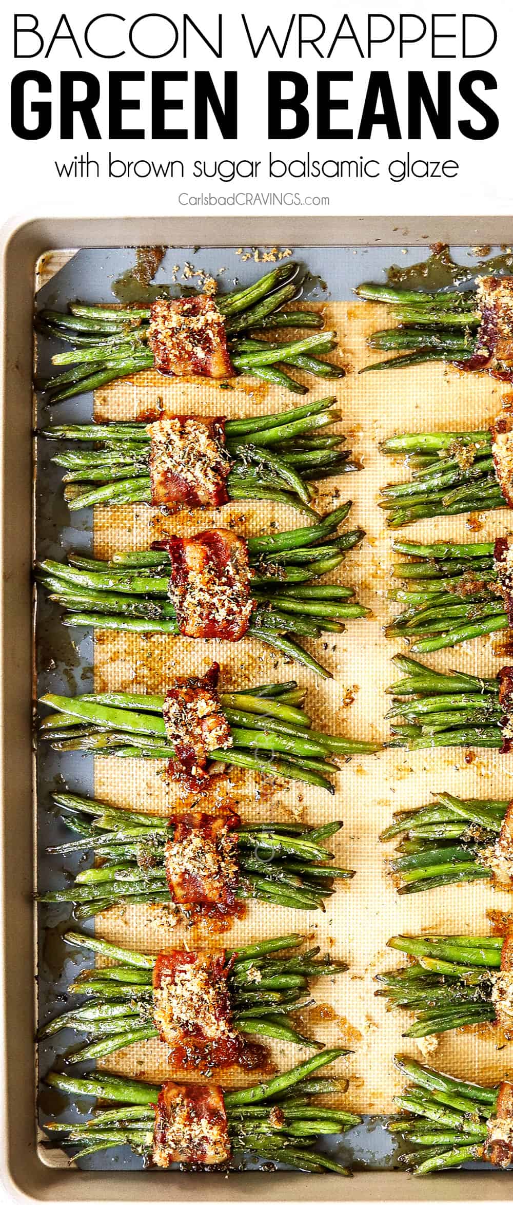 top view of bacon wrapped green beans on a baking sheet