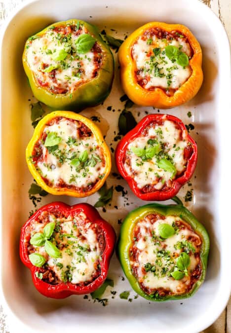 top view of stuffed peppers with Italian sausage, rice and tomatoes covered in mozzarella