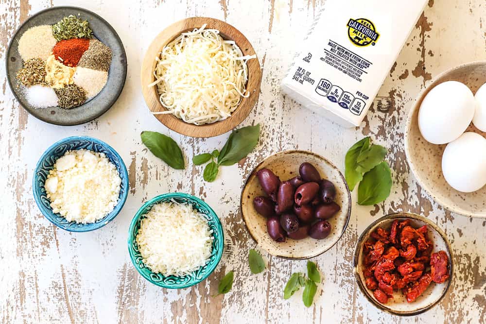 showing ingredients for Mediterranean mini quiche with olives, sun-dried tomatoes Parmesan and basil