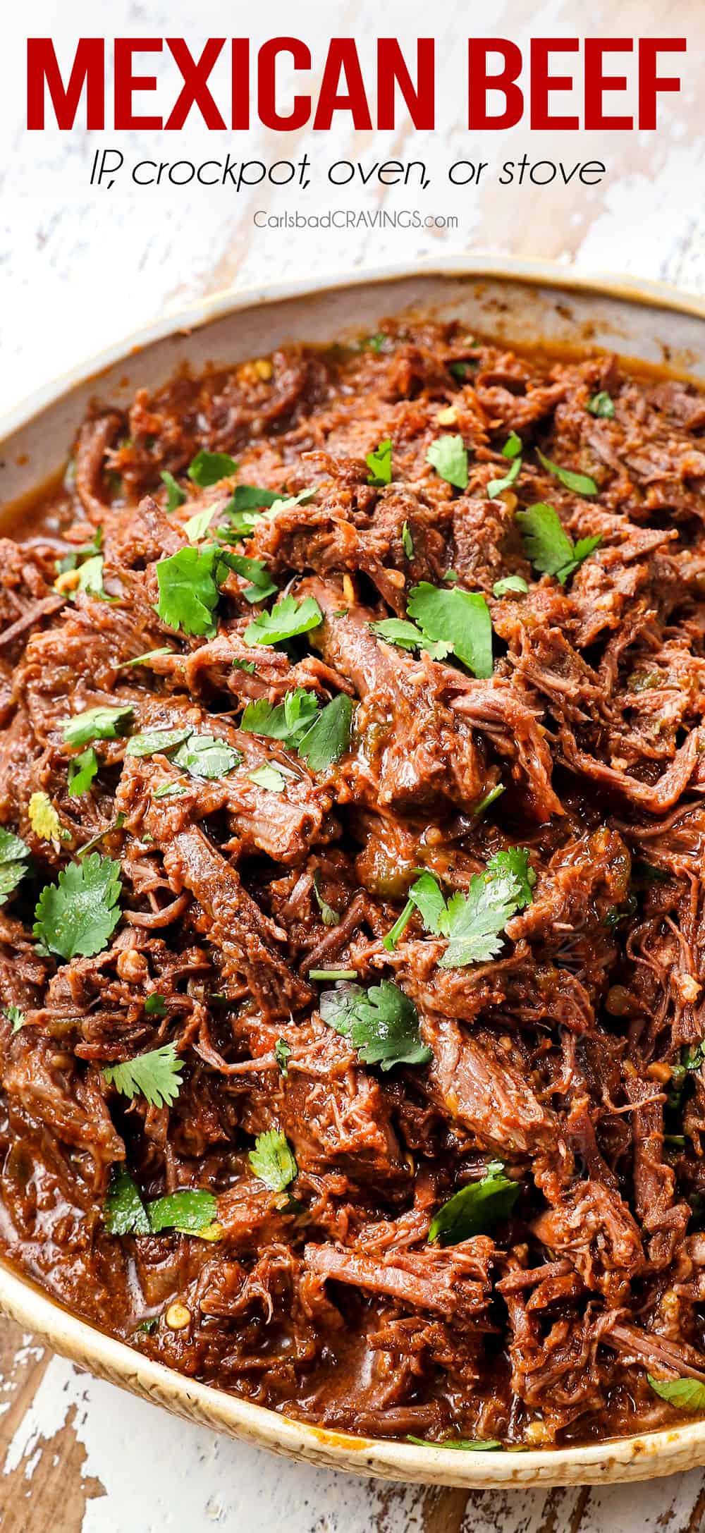 up close or Mexican shredded beef in a bowl showing how juicy it is