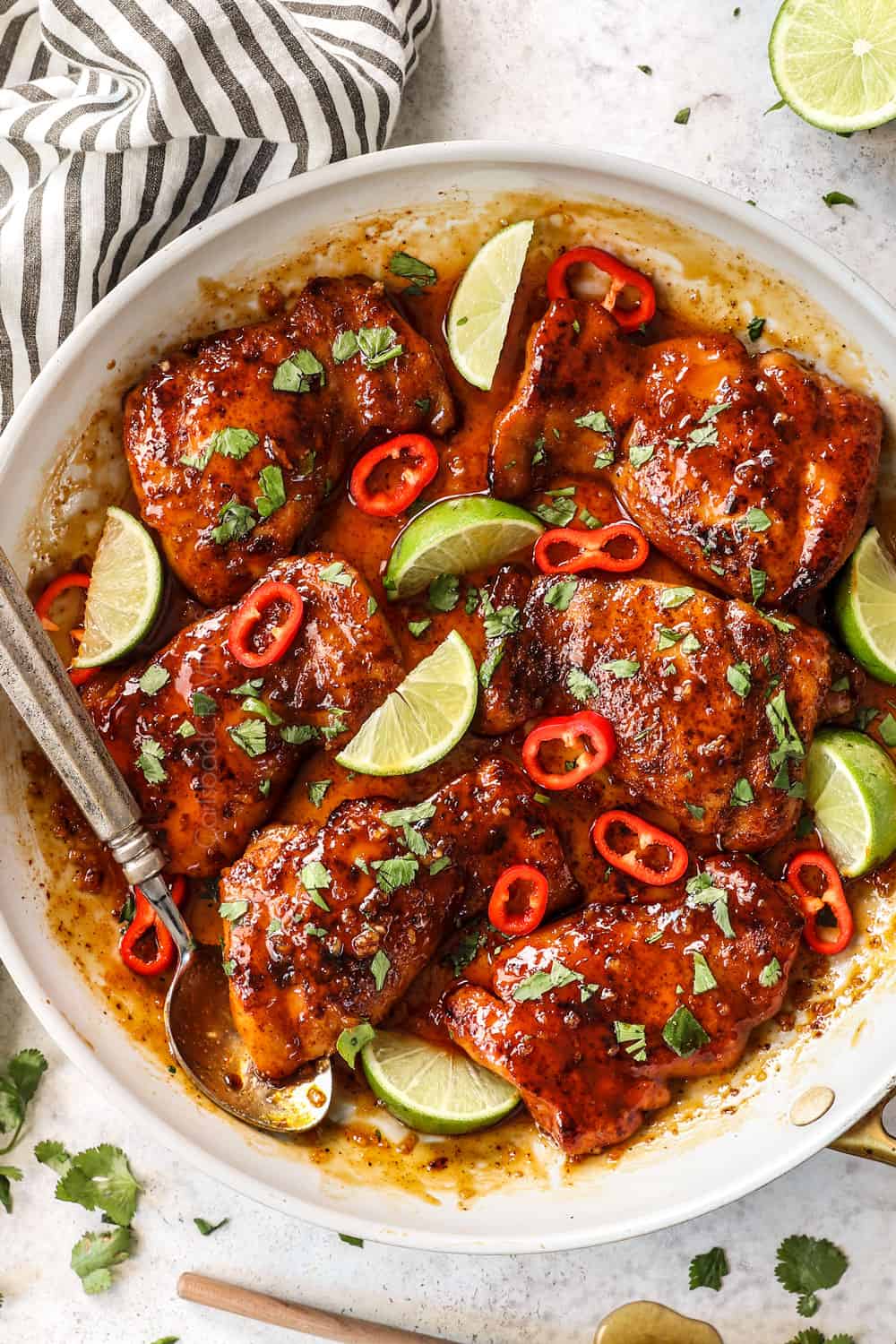 showing how to make honey lime chicken thighs recipe by simmering chicken in honey lime sauce