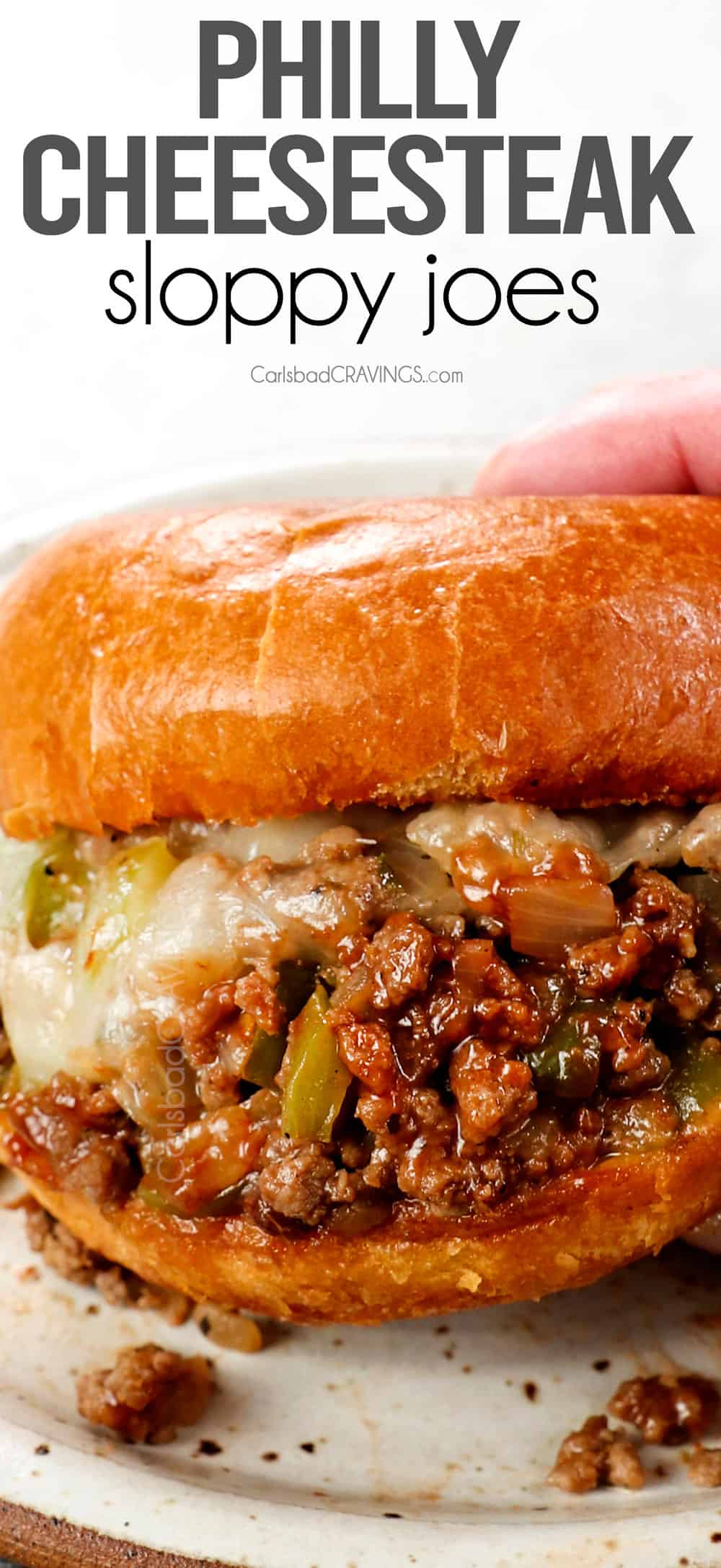 up close of holding a Philly Cheesesteak Sloppy Joe