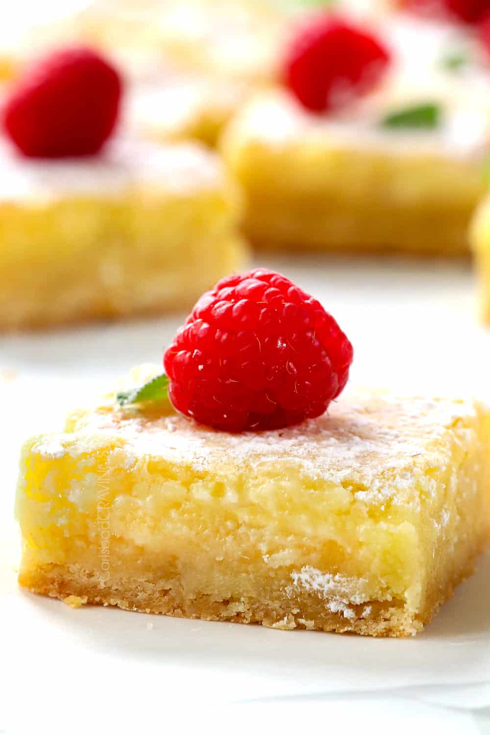 up close of a slice of Ooey Gooey Butter Cake showing how gooey it is