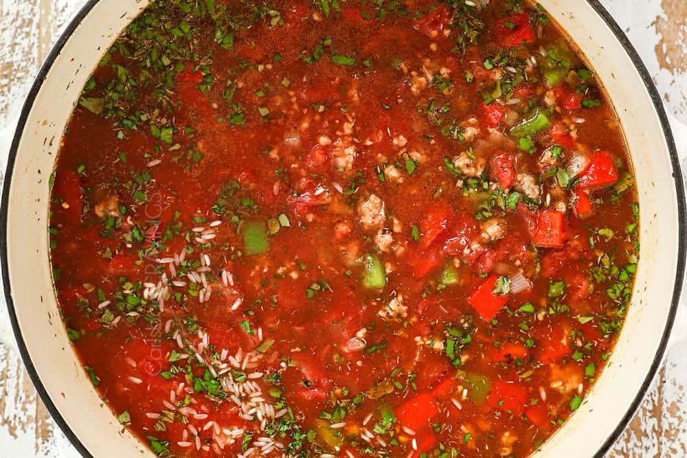 showing how to make stuffed pepper soup recipe by simmering the soup until the rice is tender