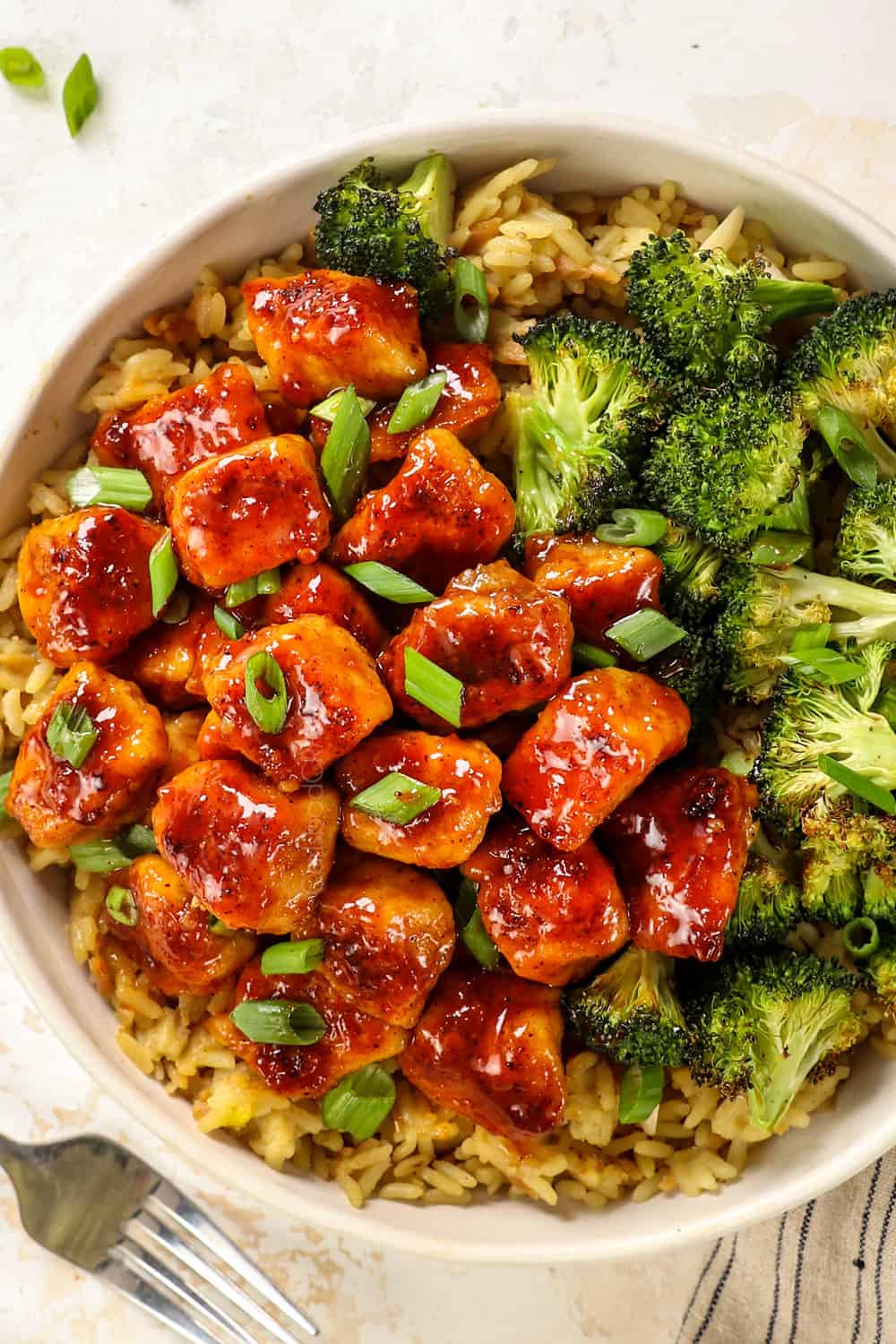 top view of apricot shrimp in a bowl with broccoli and rice showing how to serve it