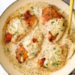 top view of creamy garlic Parmesan chicken in a skillet showing how creamy the Parmesan sauce is