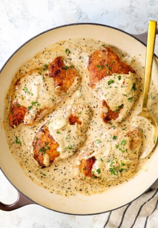 top view of creamy garlic Parmesan chicken in a skillet showing how creamy the Parmesan sauce is