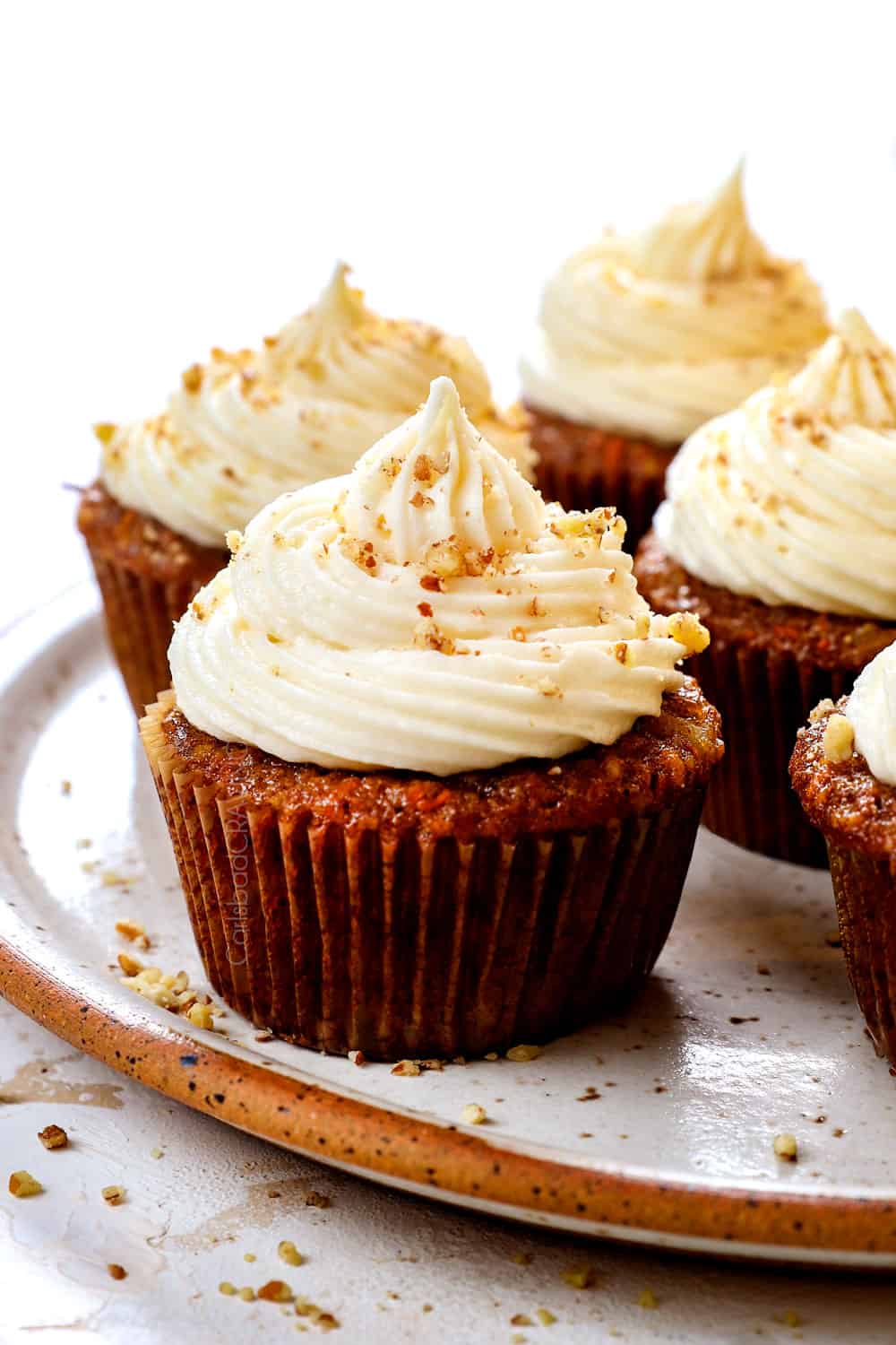 up close of carrot cake cupcakes recipe on a plate with pineapple