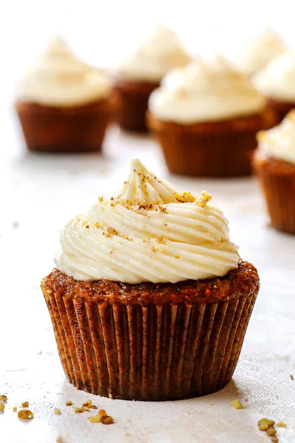 carrot cake cupcakes recipe with pineapple and pecans and cream cheese frosting