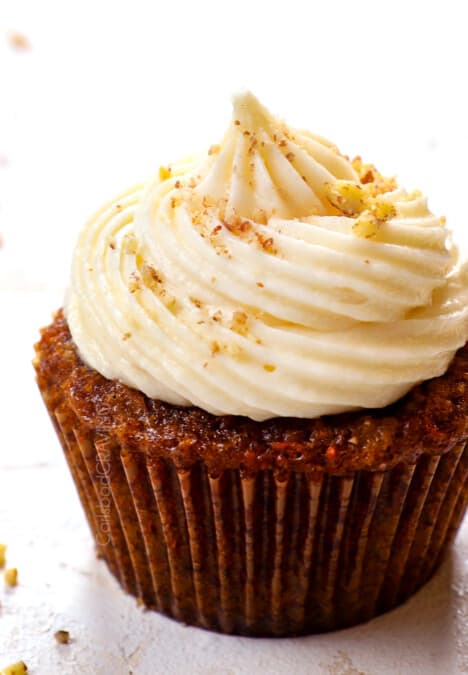 up close of carrot cake cupcake with cream cheese frosting