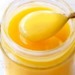 up close of lemon curd in a jar showing how creamy it is