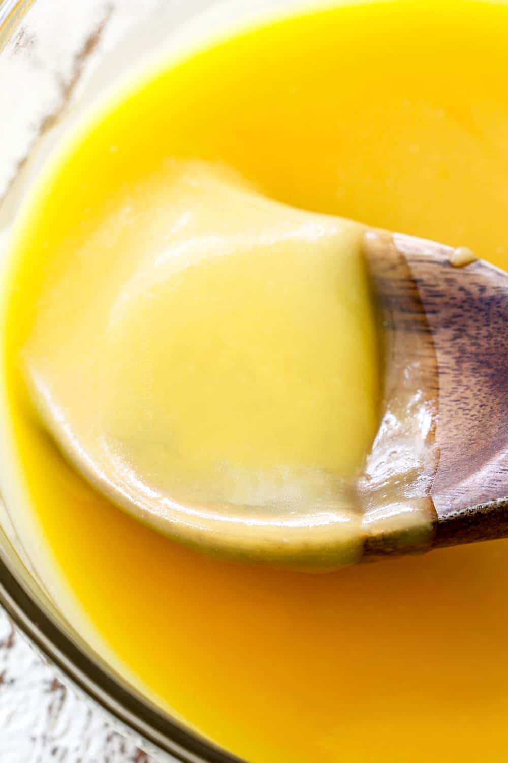 showing how to make lemon curd by stirring until smooth and creamy
