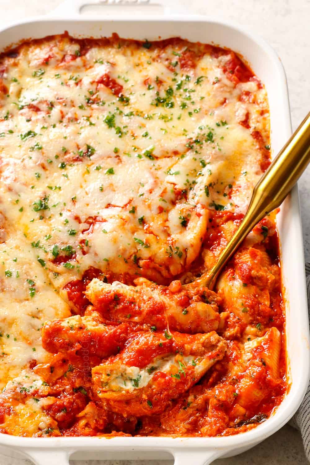 up close of stuffed shells with meat in a 9x13 baking dish