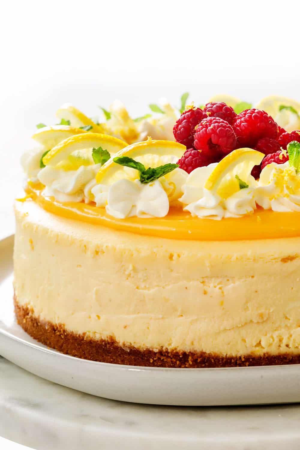 lemon cheesecake on platter showing how creamy it is