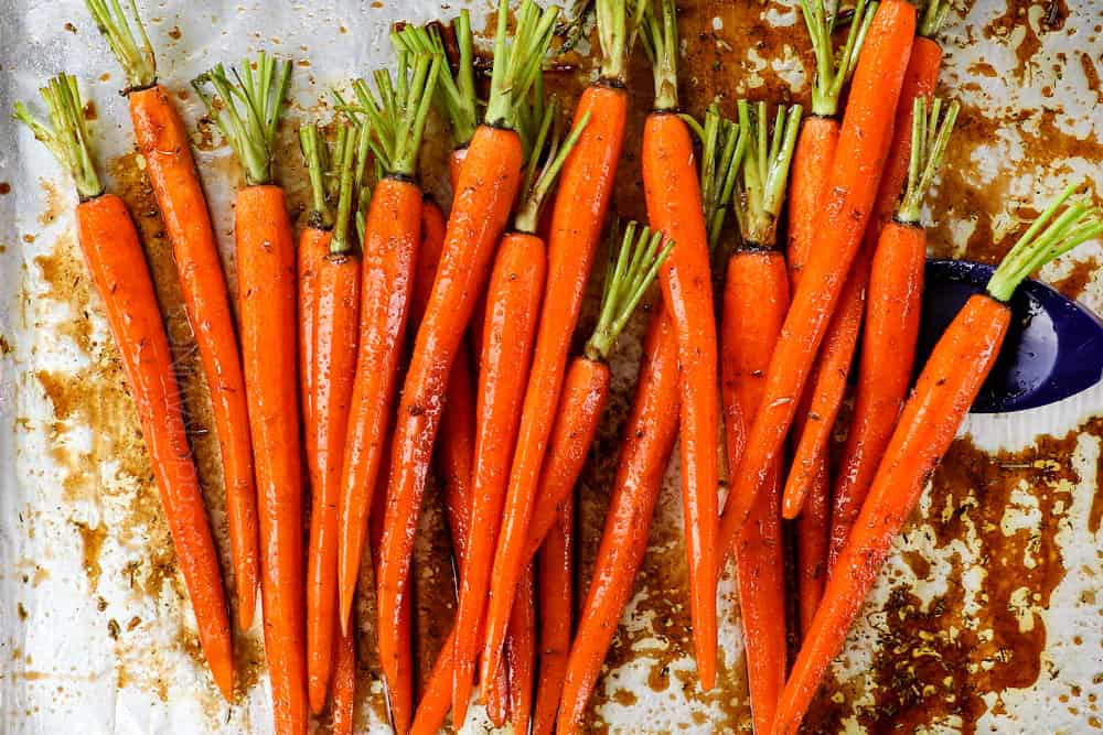 showing how to cook roasted carrots by tossing in balsamic sauce