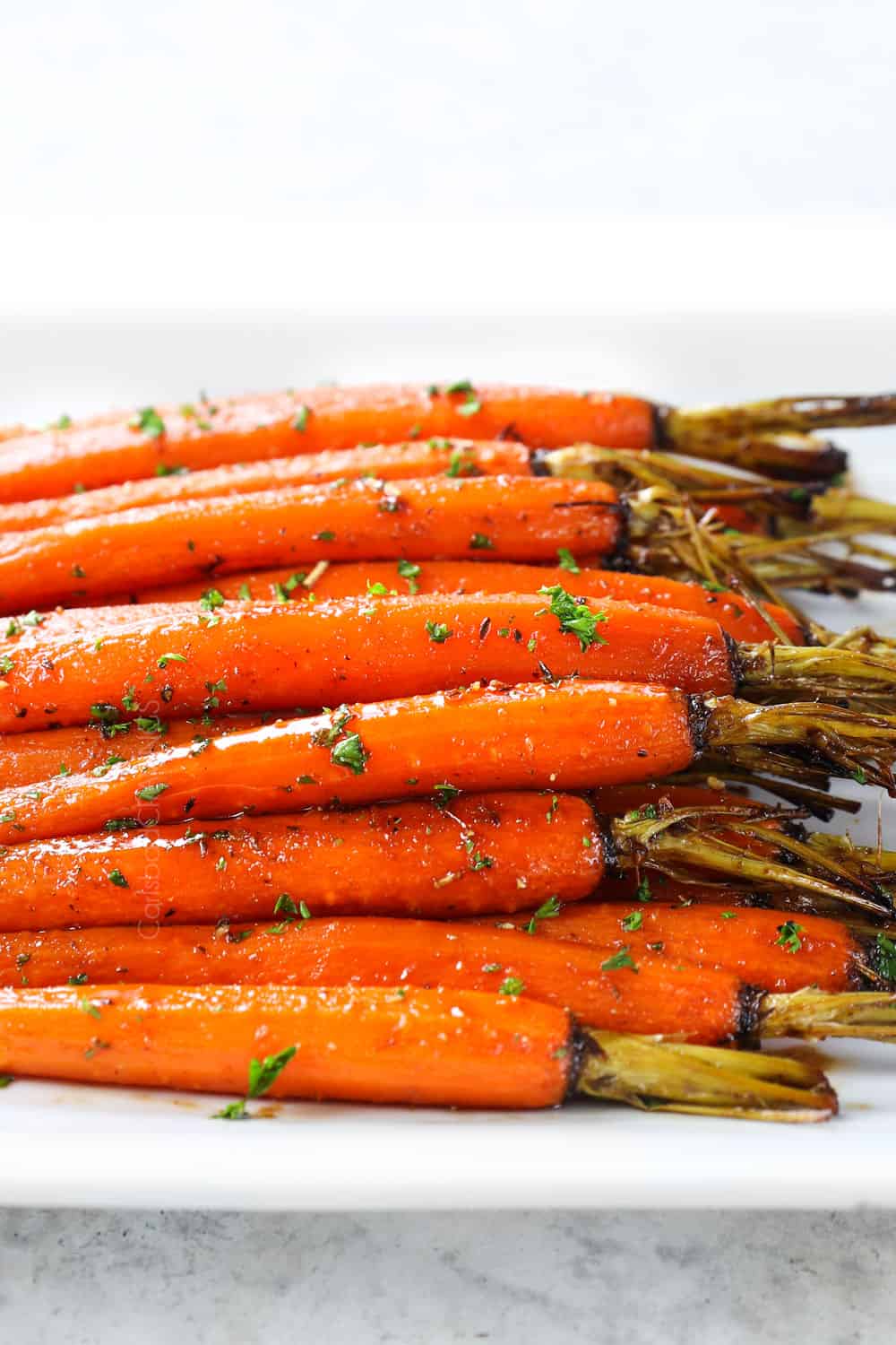 oven roasted carrots served in a white dish