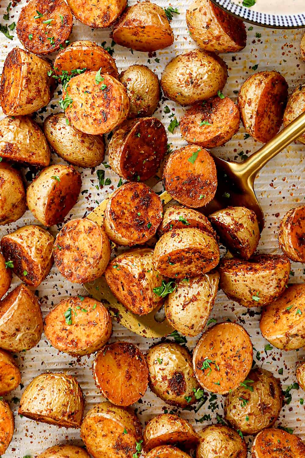 showing how to make roasted Cajun potatoes by baking in the oven until tender and crispy