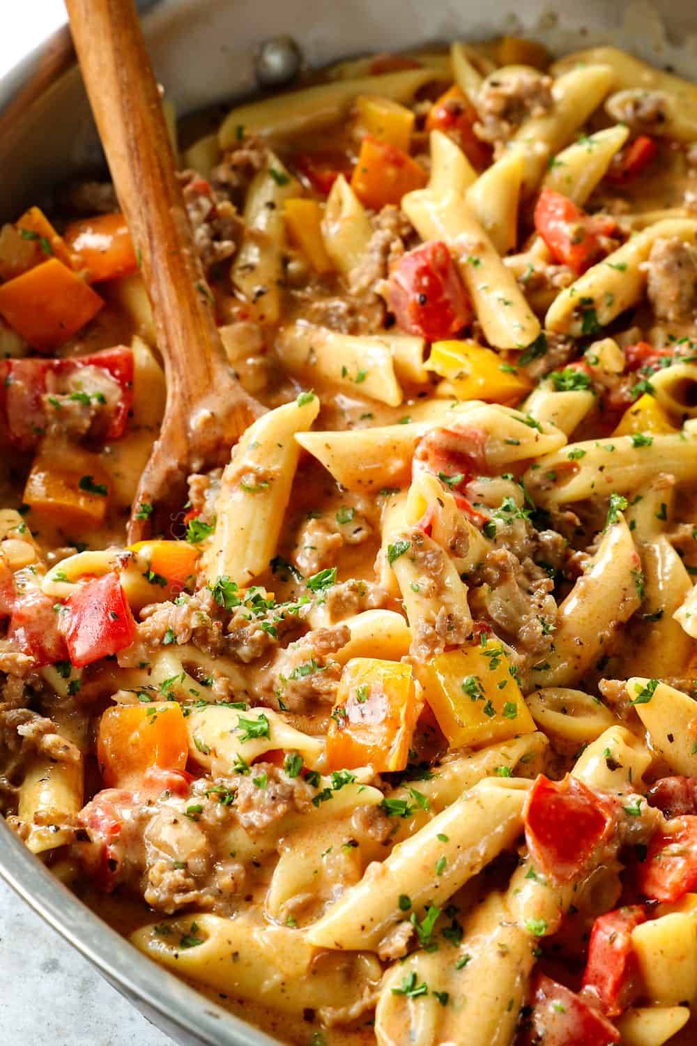 up close of sausage peppers pasta recipe with Italian sausage showing how creamy it is