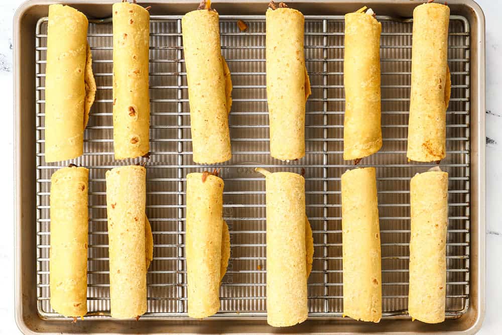 showing how to make taquitos by spreading on a baking rack to bake in the oven
