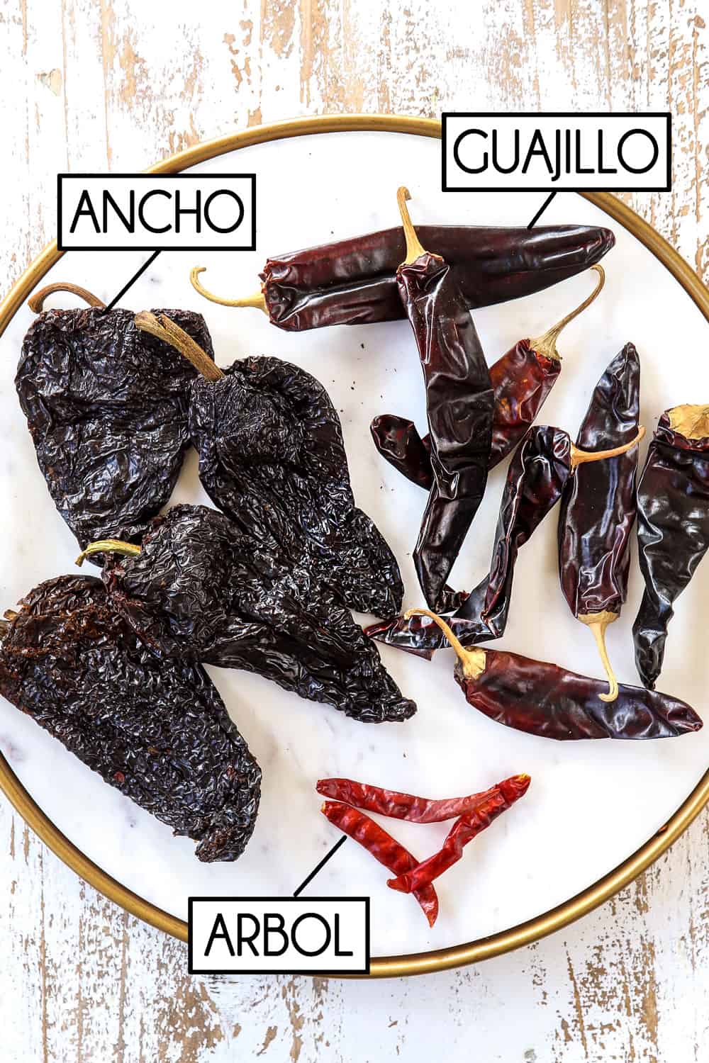 showing how to make adobo sauce by showing what guajillo chilies, ancho chilies and arbol chilies look like