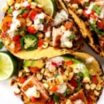 top view of easy fish tacos with salmon with corn salsa