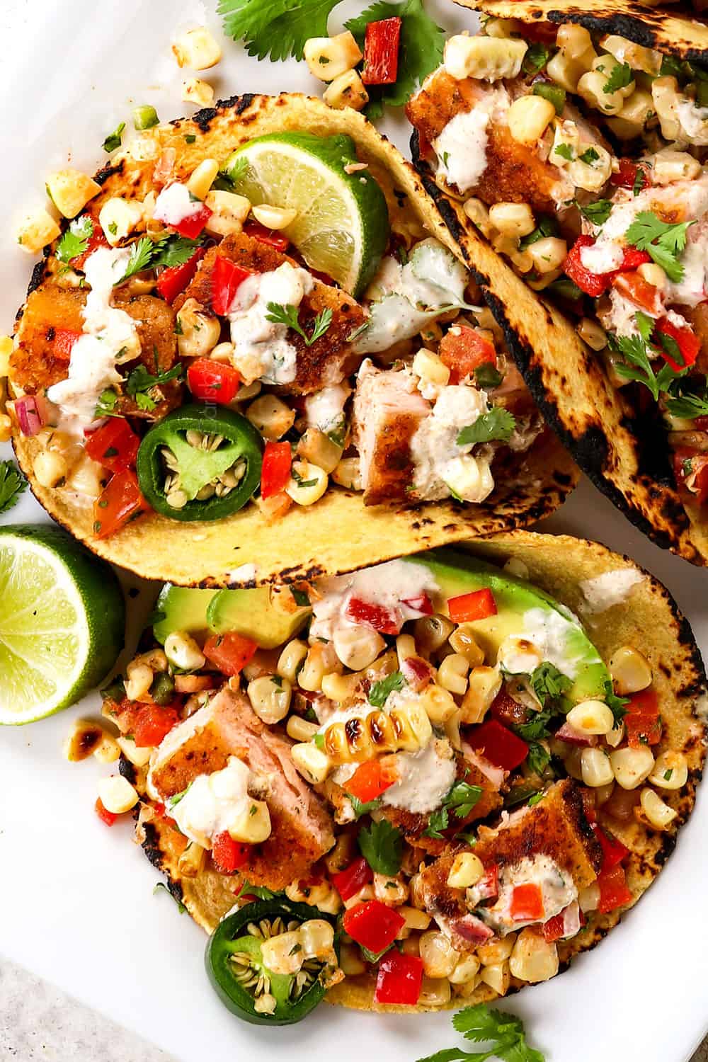 top view of easy fish tacos with salmon with corn salsa