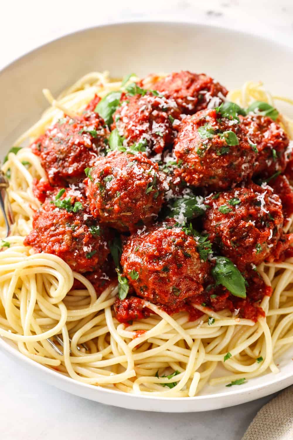 showing ways to serve Italian turkey meatballs by serving as spaghetti and meatballs with marinara sauce