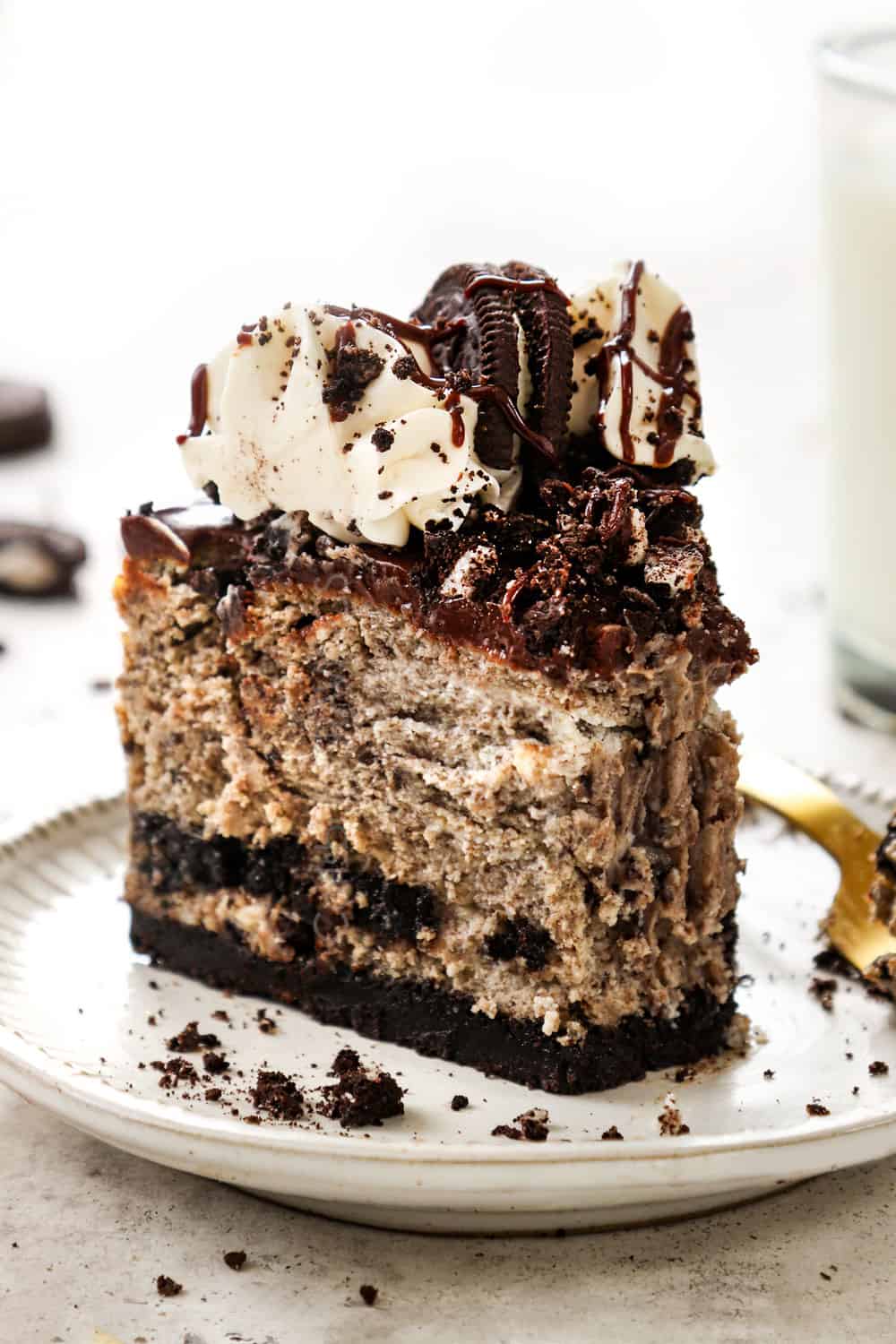 a slice of Oreo cheesecake with a bite taken out