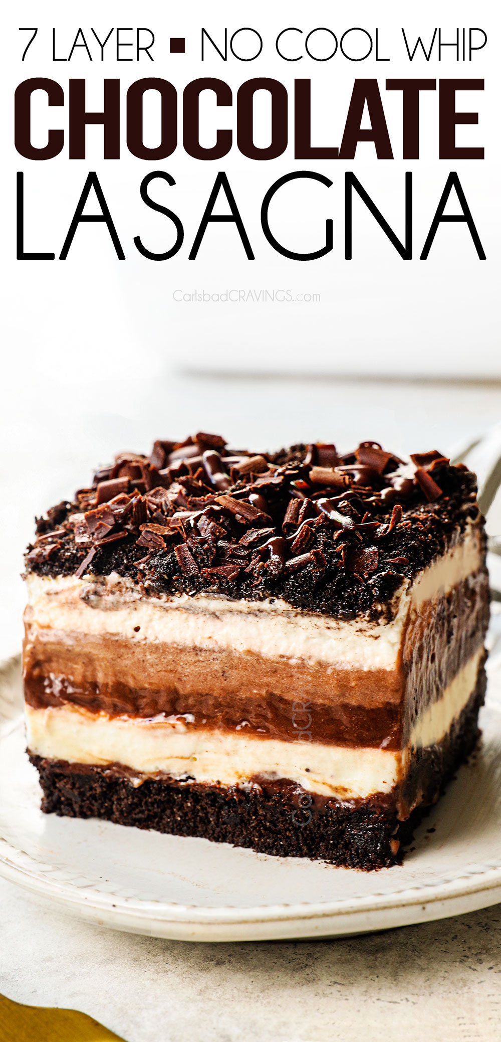 a slice of chocolate lasagna showing the distinct layers of Oreos, chocolate, cream cheese, pudding and whipped topping