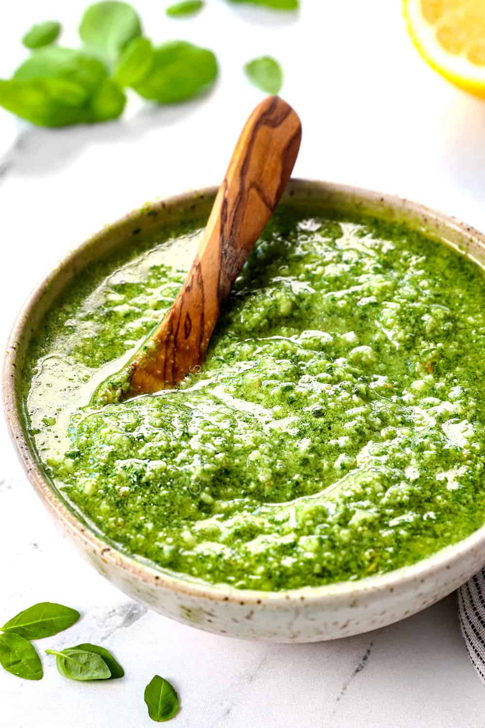 pesto recipe in a bowl for using as a dip, spread, appetizer or enhancer