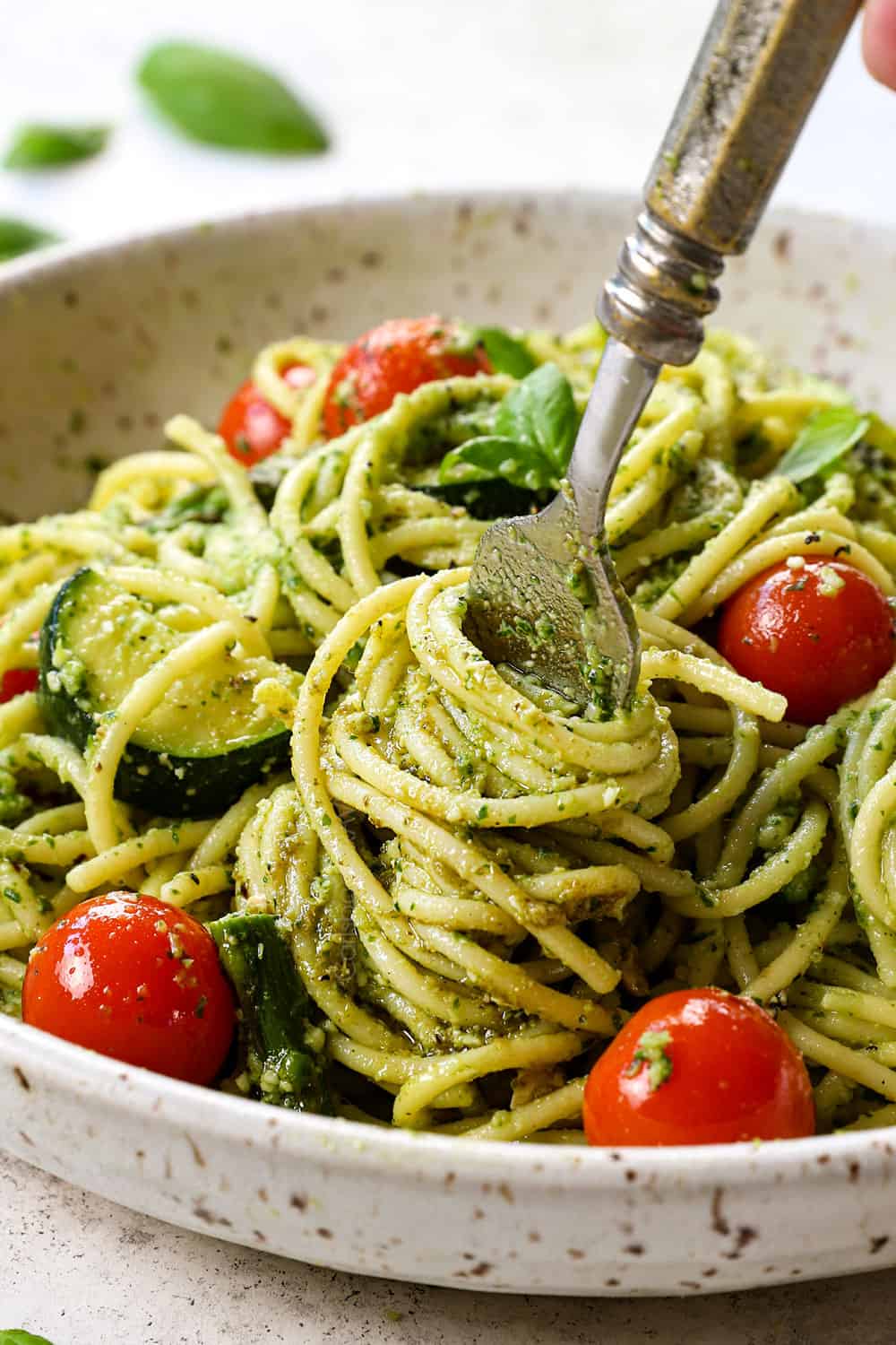 showing how to serve basil pesto by serving wit with pasta