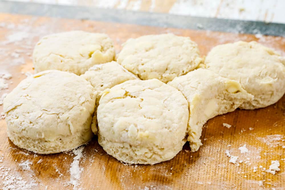 showing how to make homemade biscuits and gravy recipe by gathering scraps of dough to form two more biscuits