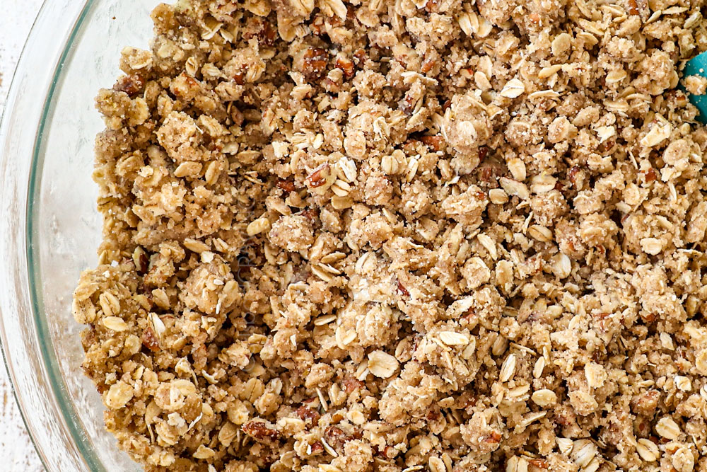 showing how to make raspberry bars by adding oats, pecans, flour, sugar, cinnamon to a bowl to make oatmeal crumble topping