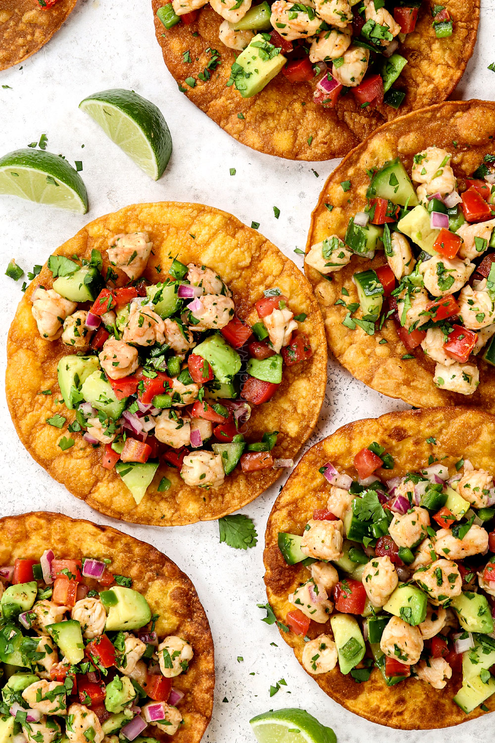 showing how to serve ceviche de camaron (shrimp ceviche) by topping tostadas with ceviche