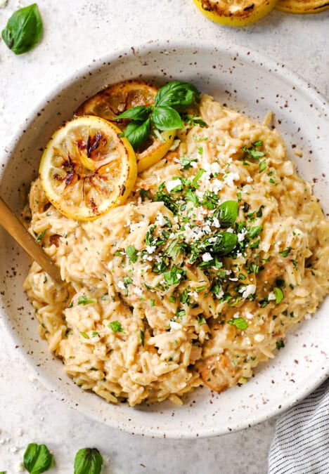top view of lemon orzo with chicken garnished by basil