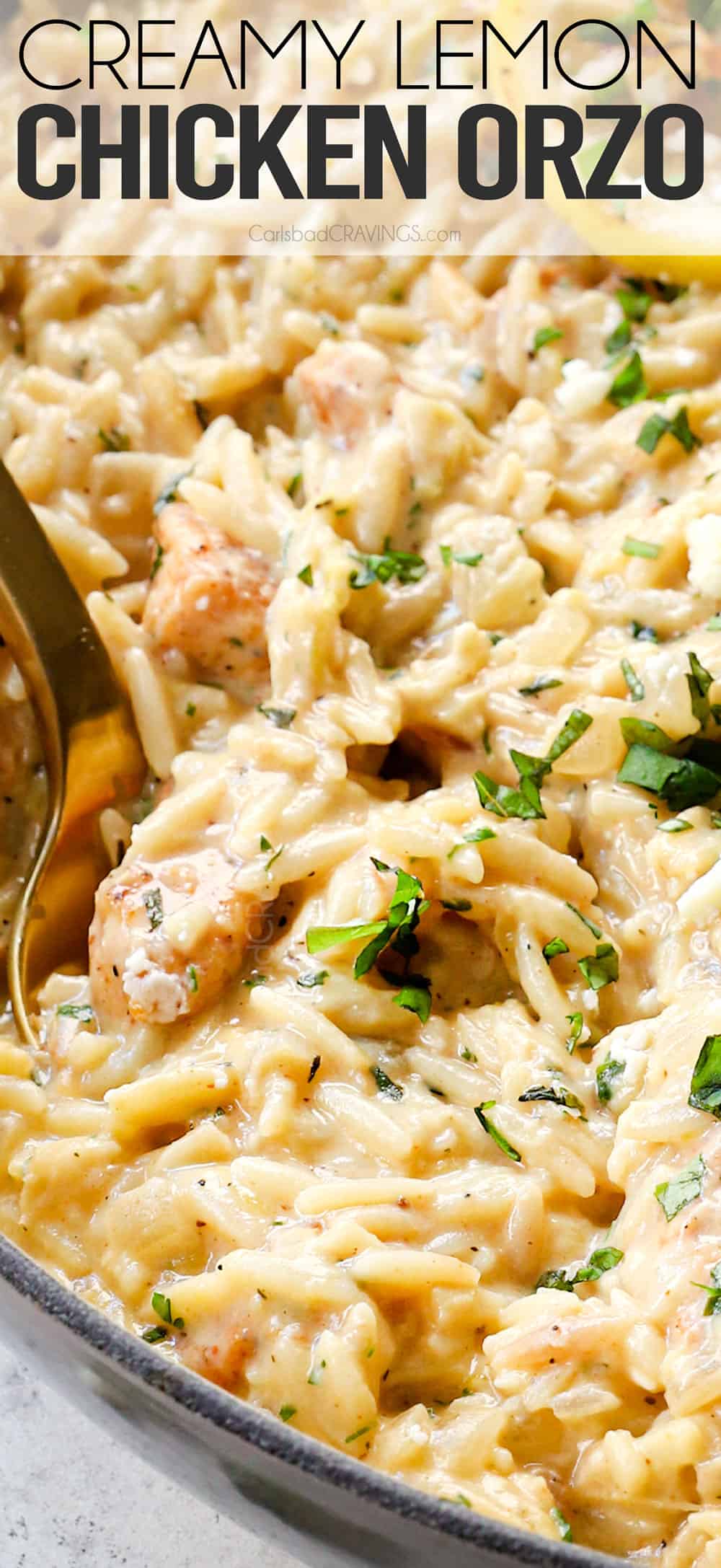up close of lemon chicken orzo with a serving spoon showing how creamy it is