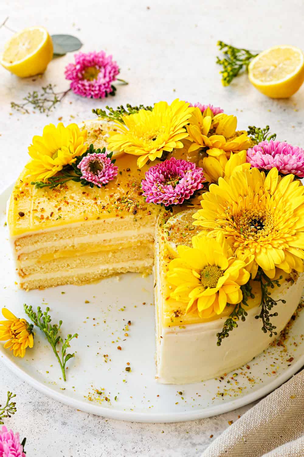 lemon cake recipe with slices removed showing the moist inside of the cake