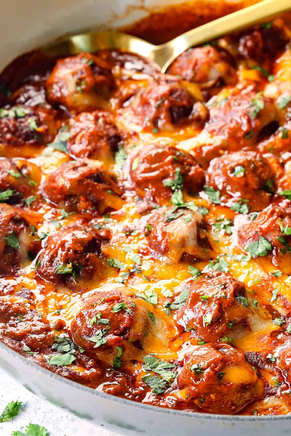 enchilada meatballs baked in the oven covered in cheese