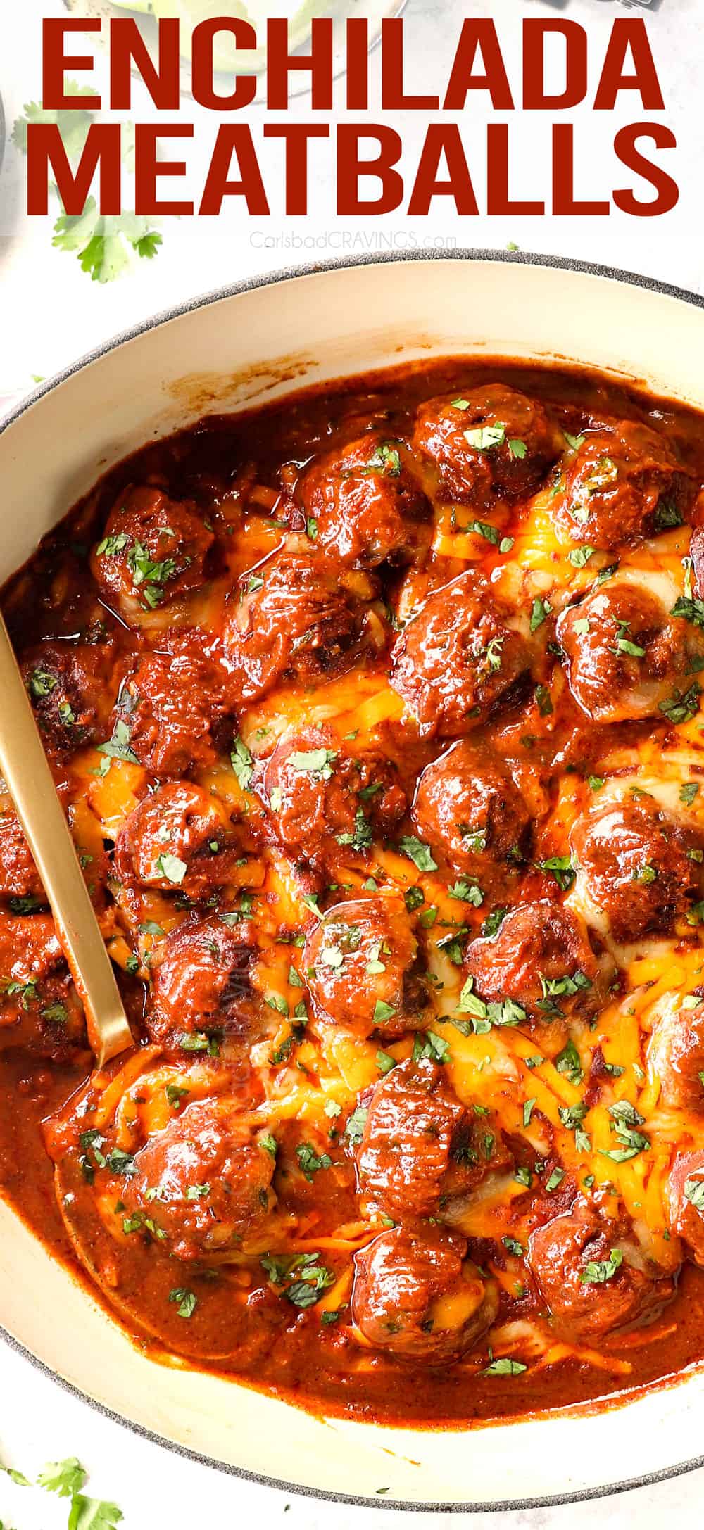 top view of baked enchilada meatballs in a skillet with cheese